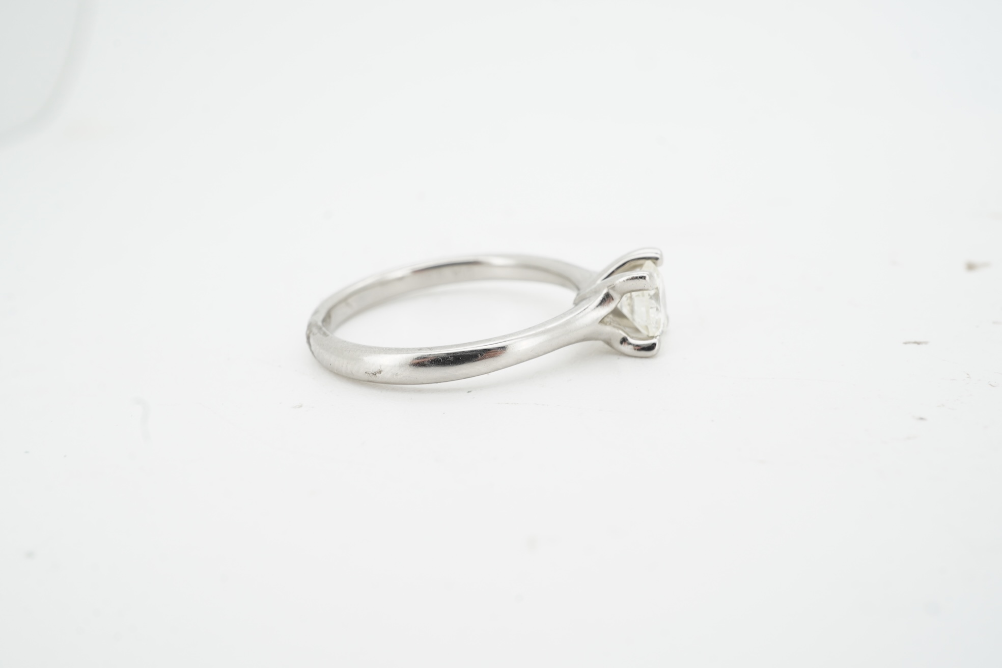 A diamond ring, claw-set with a brilliant-cut diamond weighing approximately 0.50 carats, mounted in platinum, size K, British hallmarks, gross weight approximately 4 grams